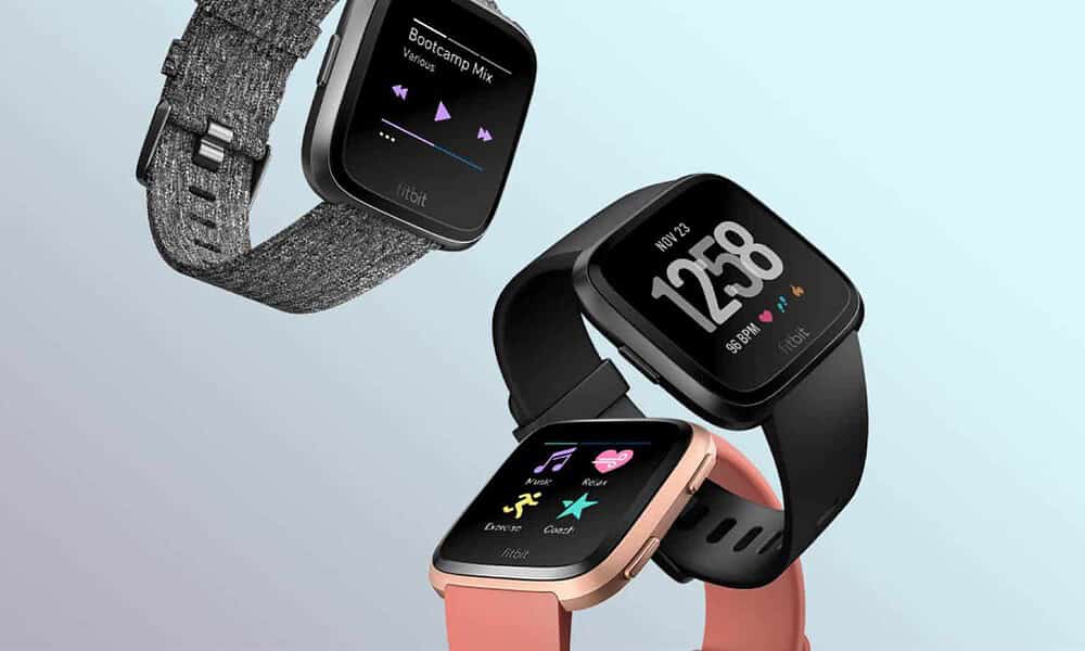 three fitbit versa blue background