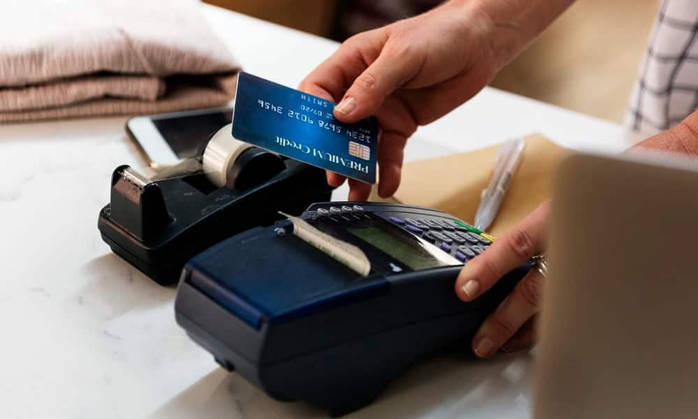 credit card being swiped at a point of sale