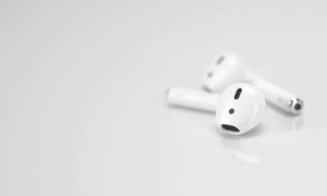 Apple airpods on table airbuddy