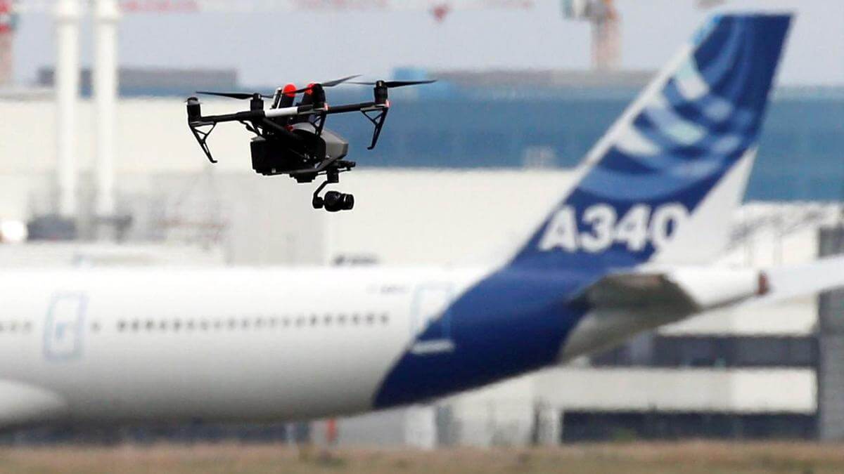 A drone flying around an airport faa