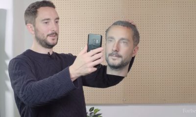 a picture of a man tricking facial recognition by using a 3D printed head