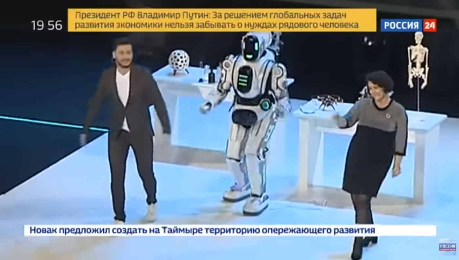 Man posing as an intelligent robot on stage