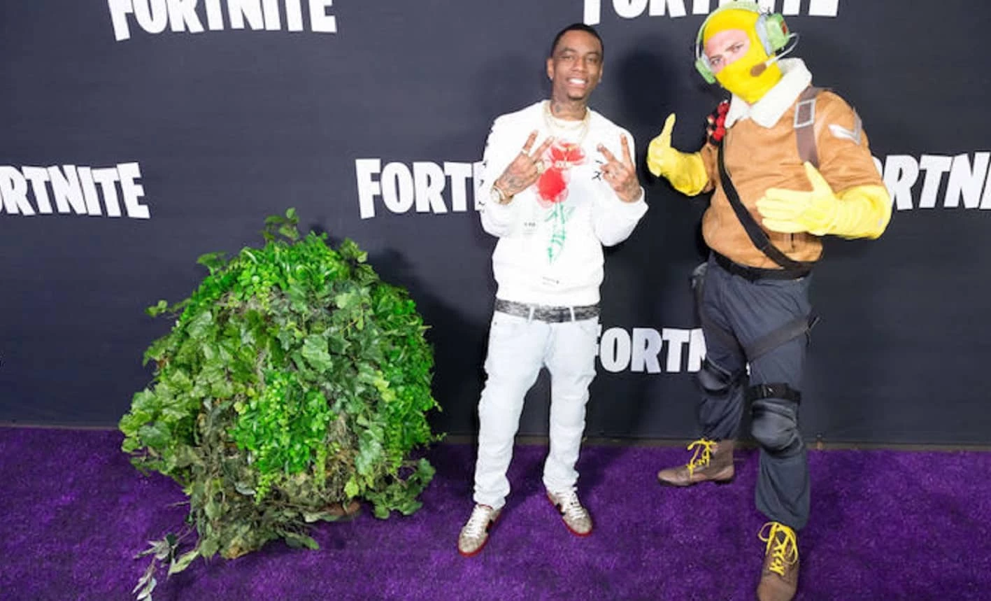 Soulja boy poses with a bush at fortnite event