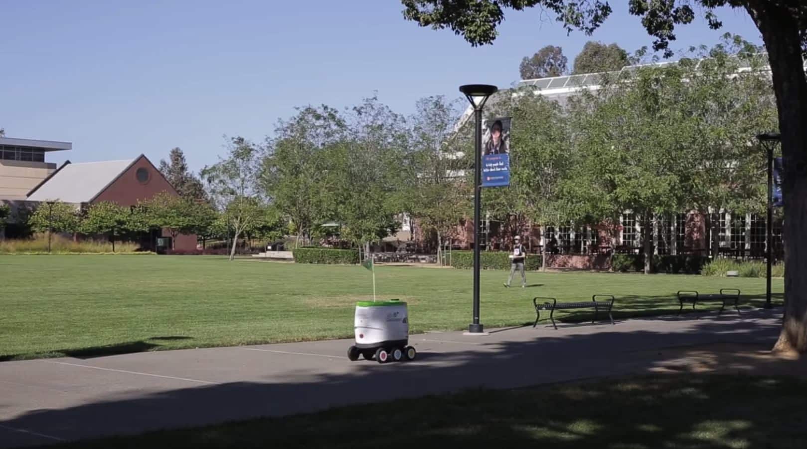 pepsico self driving robot driving around a college campus