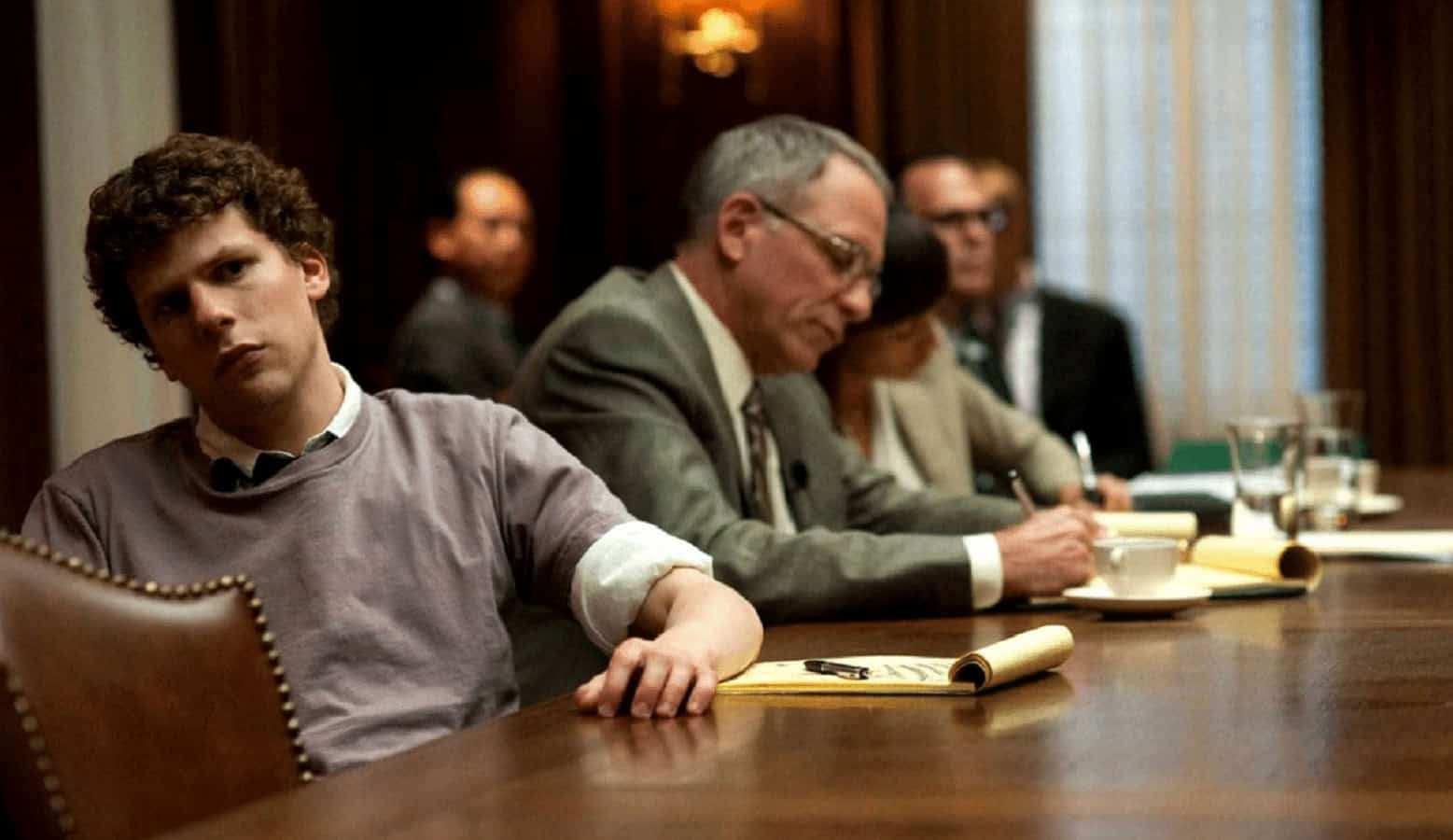 the social network movie with jesse eisenberg at table with lawyers