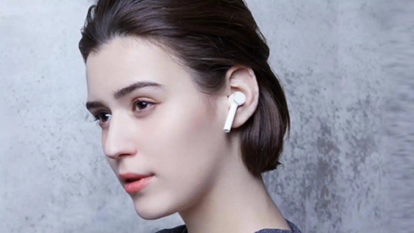 xiaomi air dots earbuds being worn in-ear