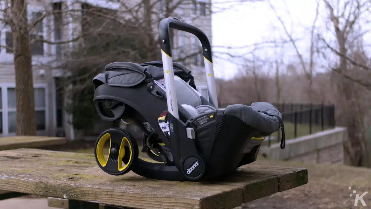 Doona car seat carrier on ground.