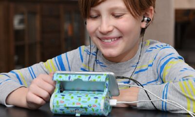 icaddy phone stand and charger being used by kid