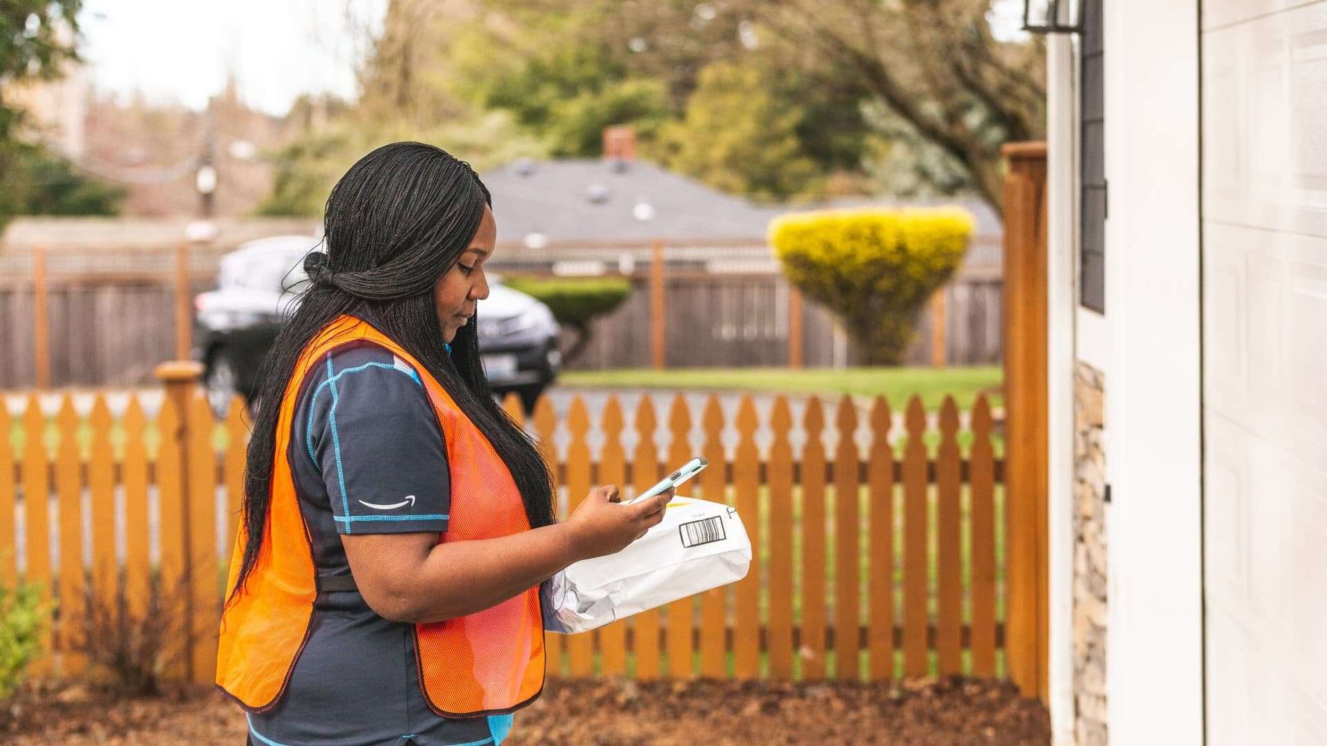 amazon deliveryperson using amazon key to put package into the customer's garage