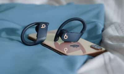 Powerbeats pro beats wireless headphones sitting on iphone