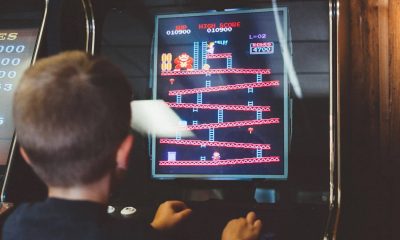 kid playing donkey kong arcade game