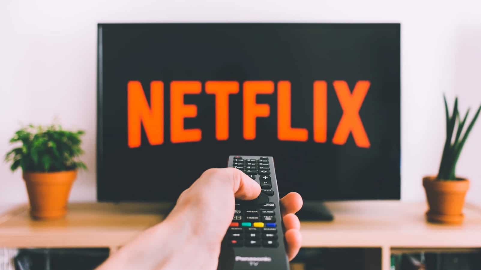 Netflix on television screen with remote