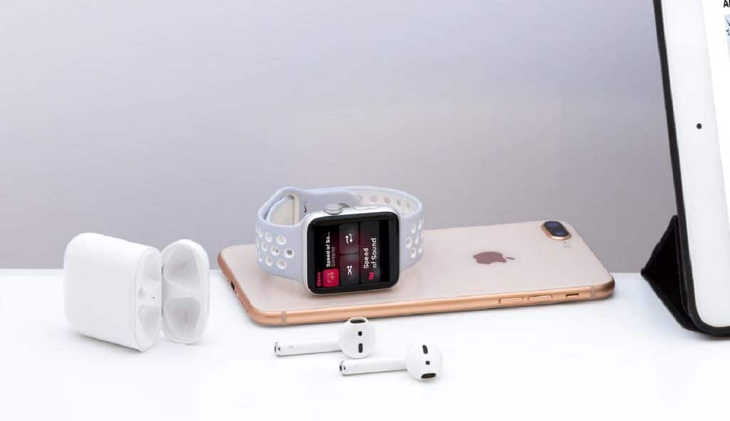 apple airpods on table with apple watch