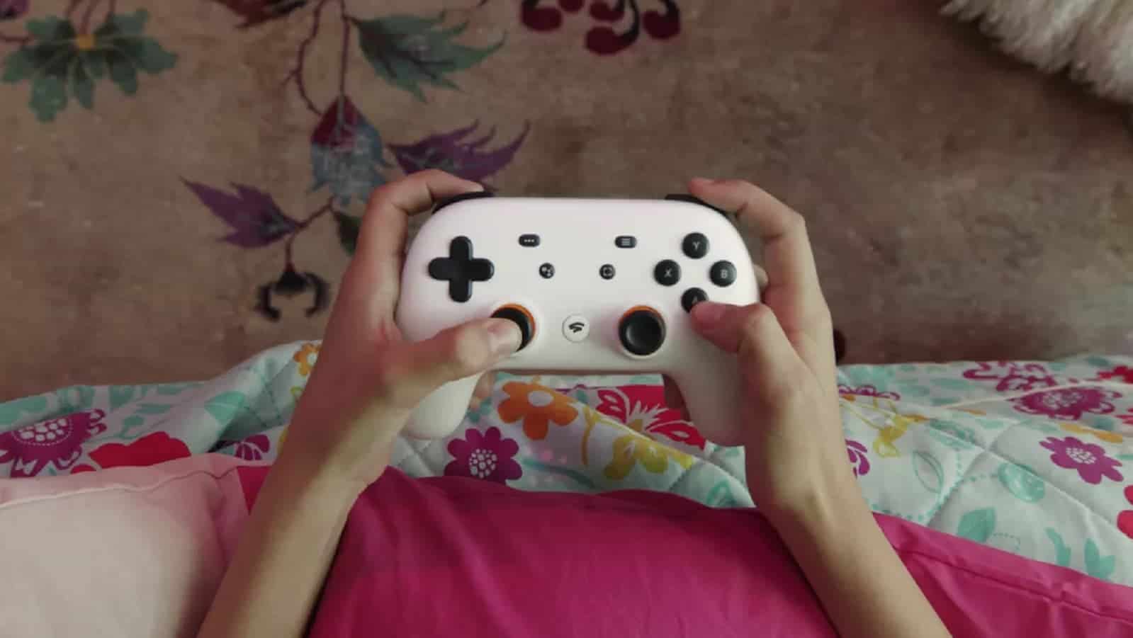 Google stadia controller in hand