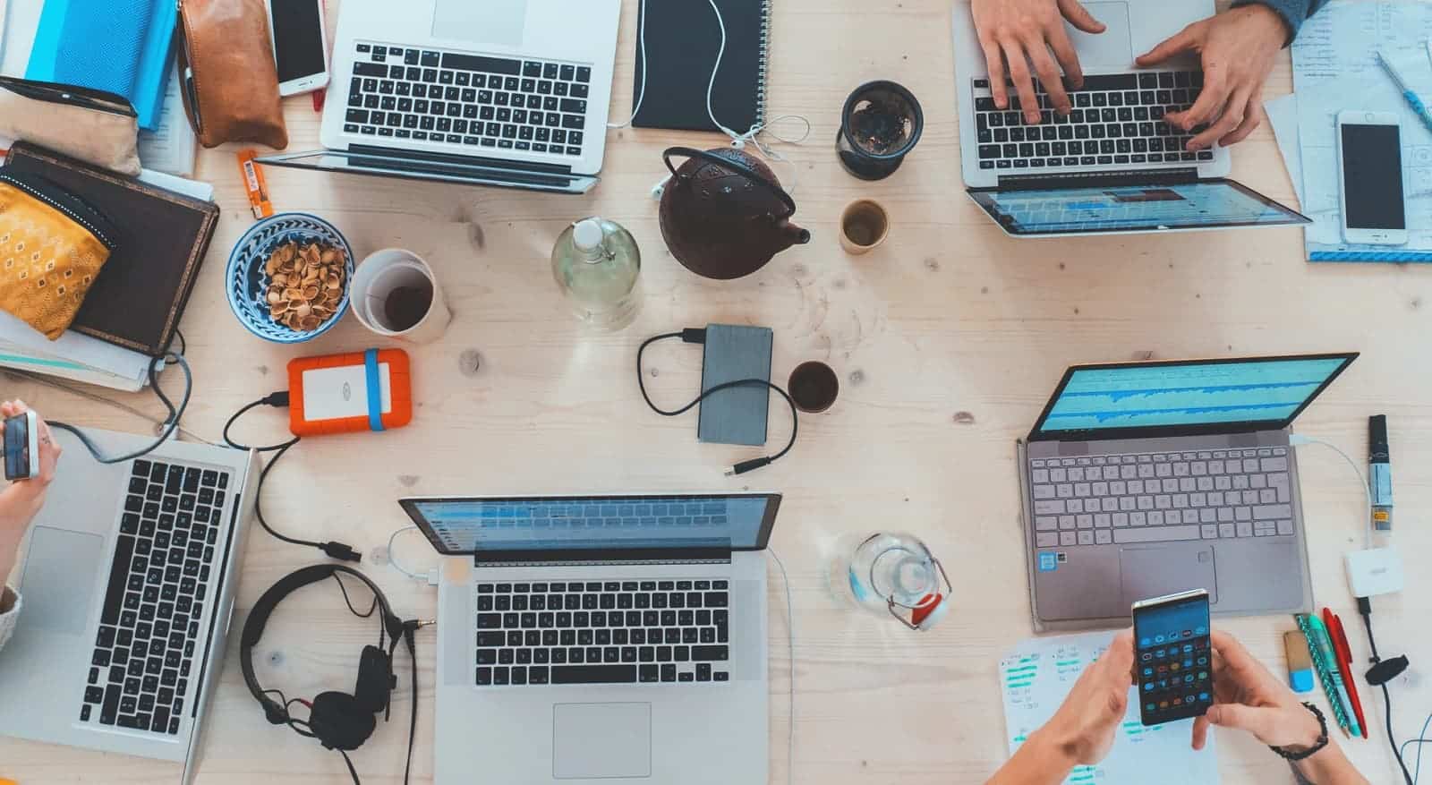 people with tech at table