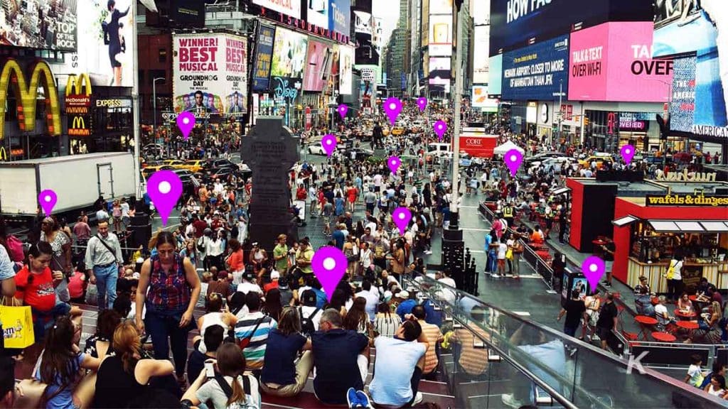 crowd of people with data points over their heads via facial recognition