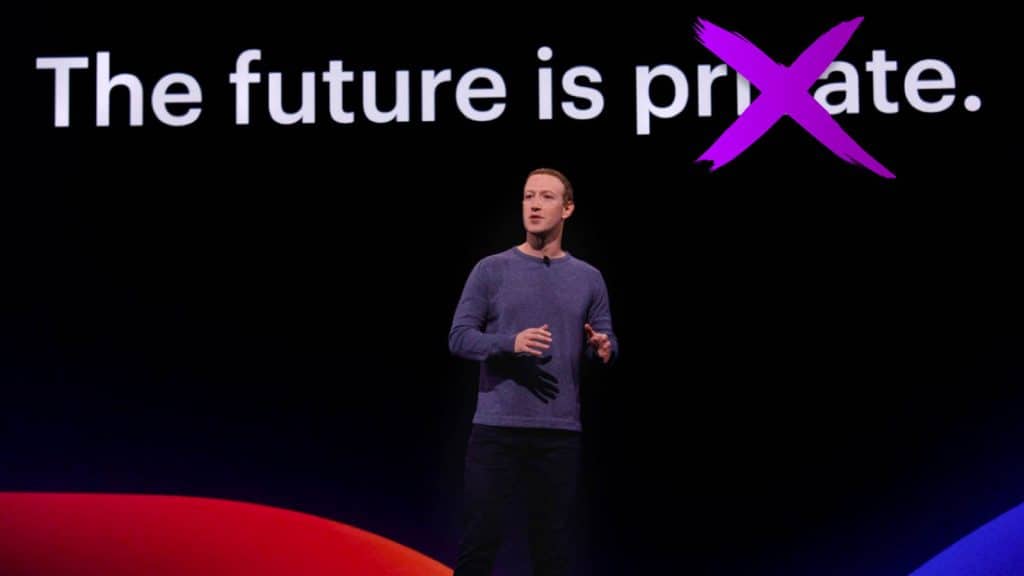 mark zuckerberg standing in front of privacy text