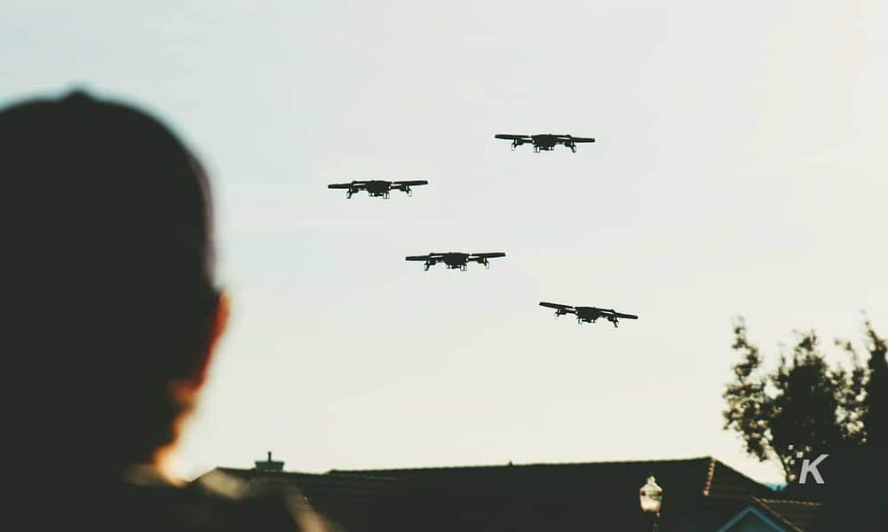 drones flying over a house