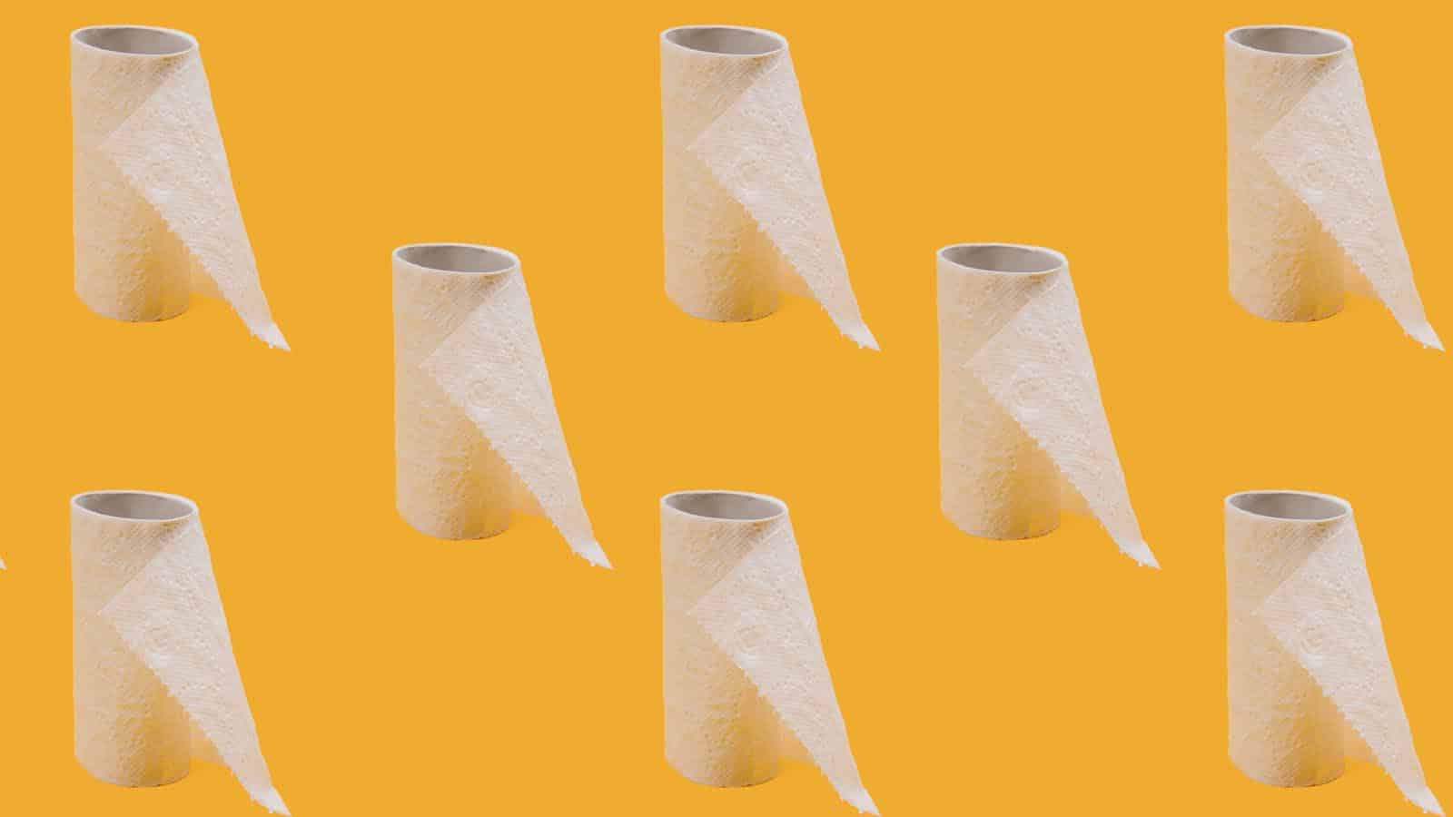 Toilet paper on yellow background