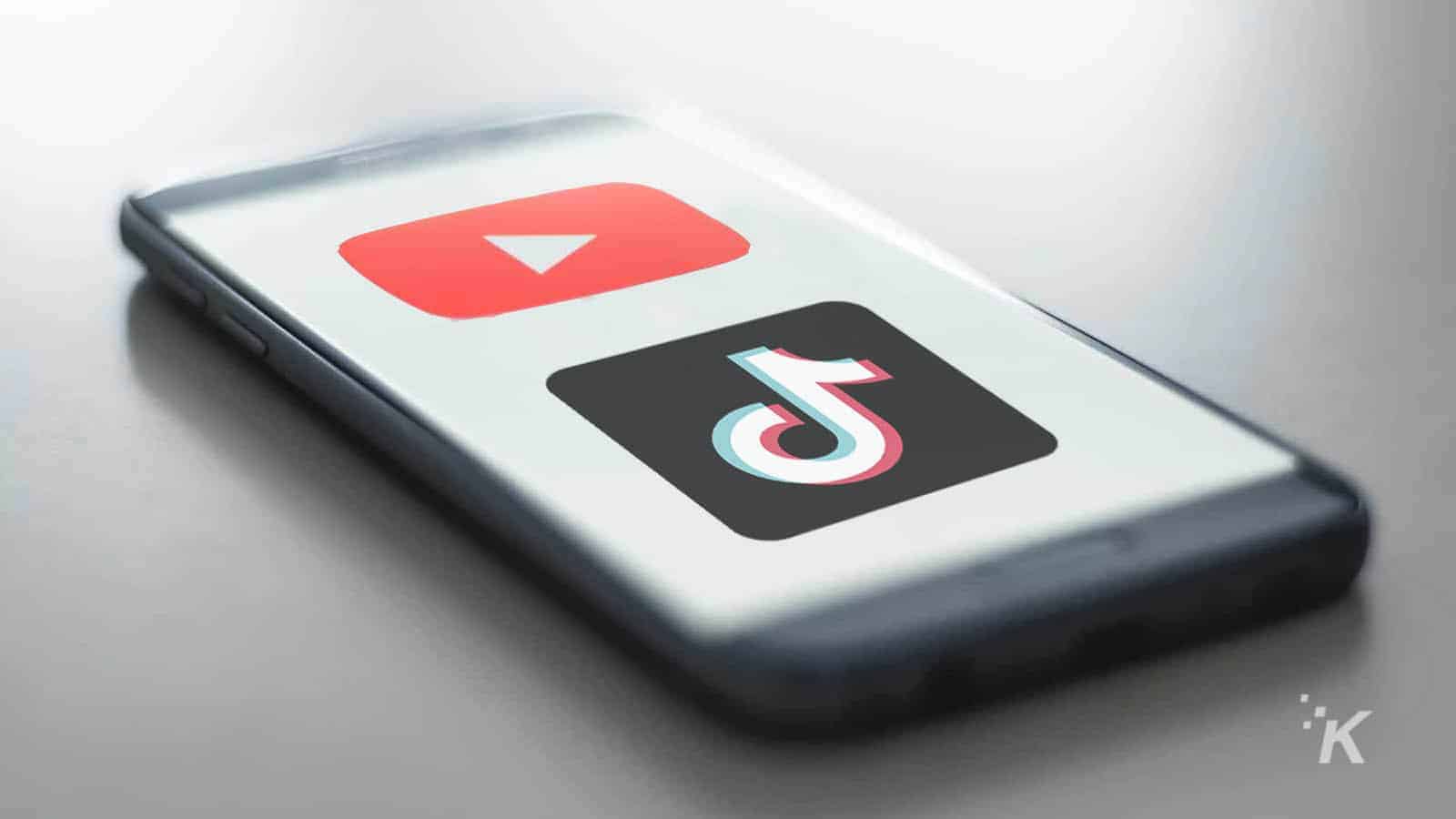 Youtube and tiktok logos on phone