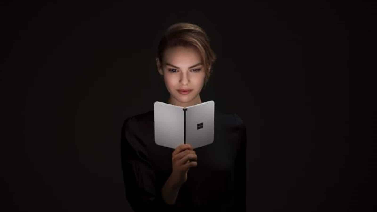 Surface duo device held by woman