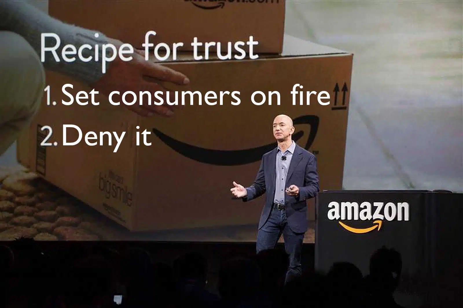 jeff bezos stood in front of a screent that reads Recipe for Trust 1. Set consumers on fire 2. Deny it