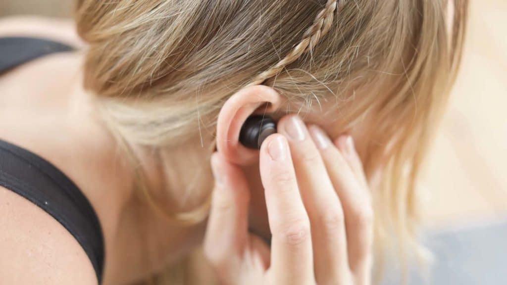 headphones in ear during a workout