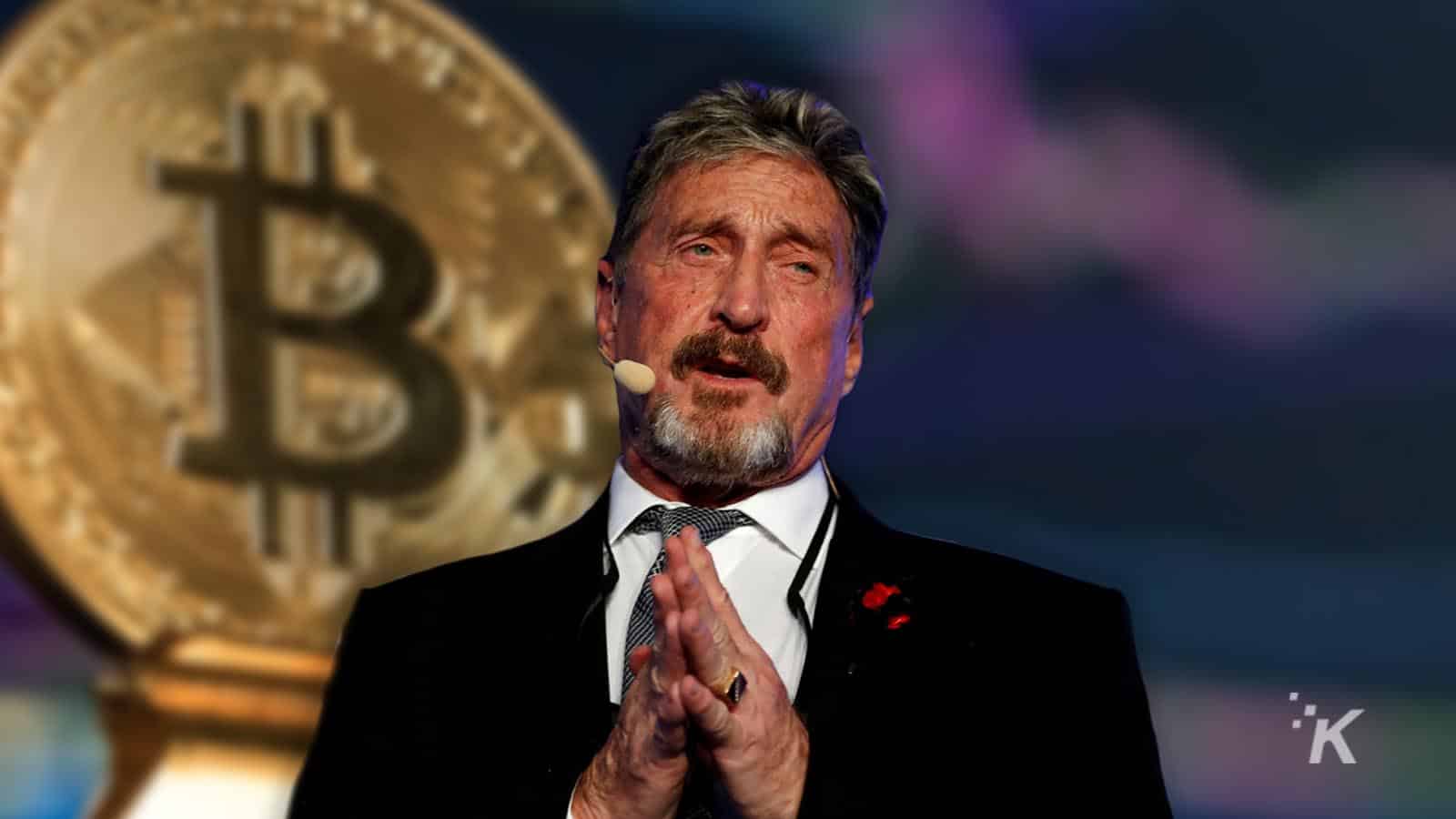 John mcafee in front of bitcoin coin