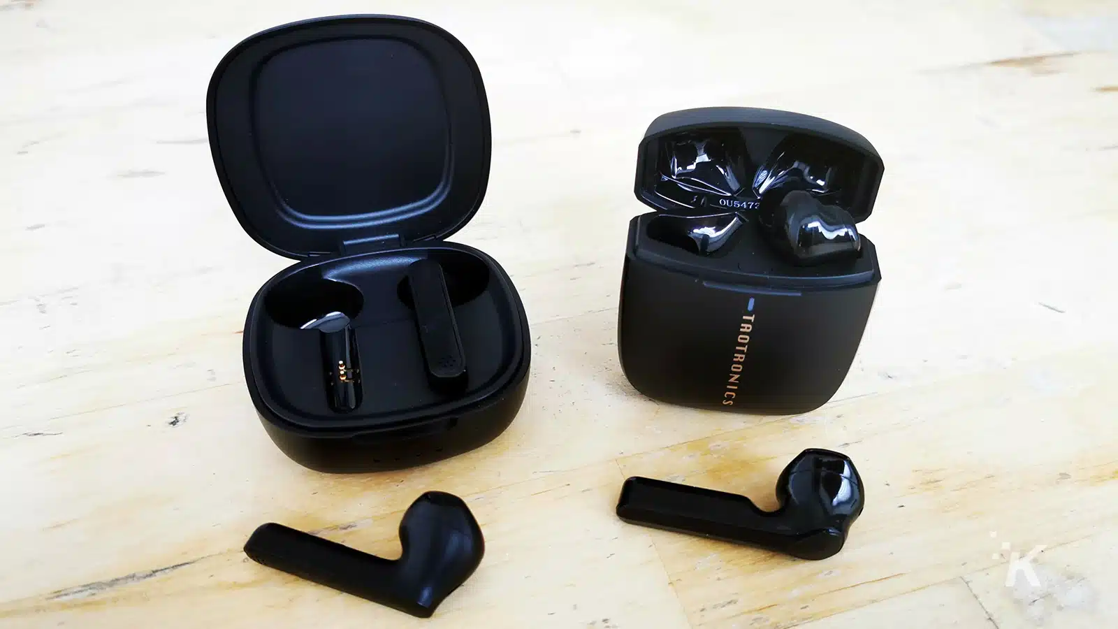 taotronics 88 and 92 cases open with left earbuds removed