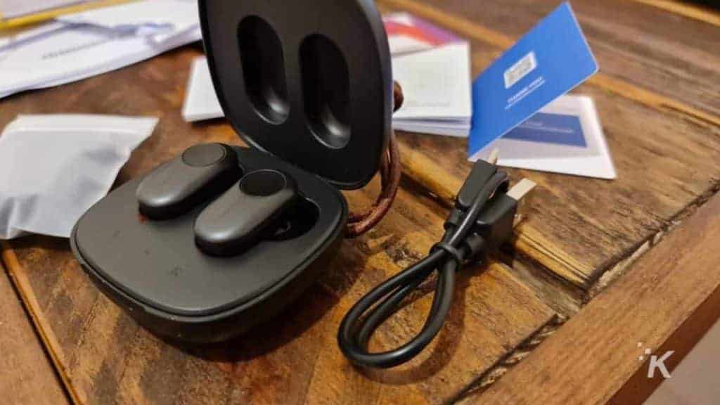 Coumi earbuds on table