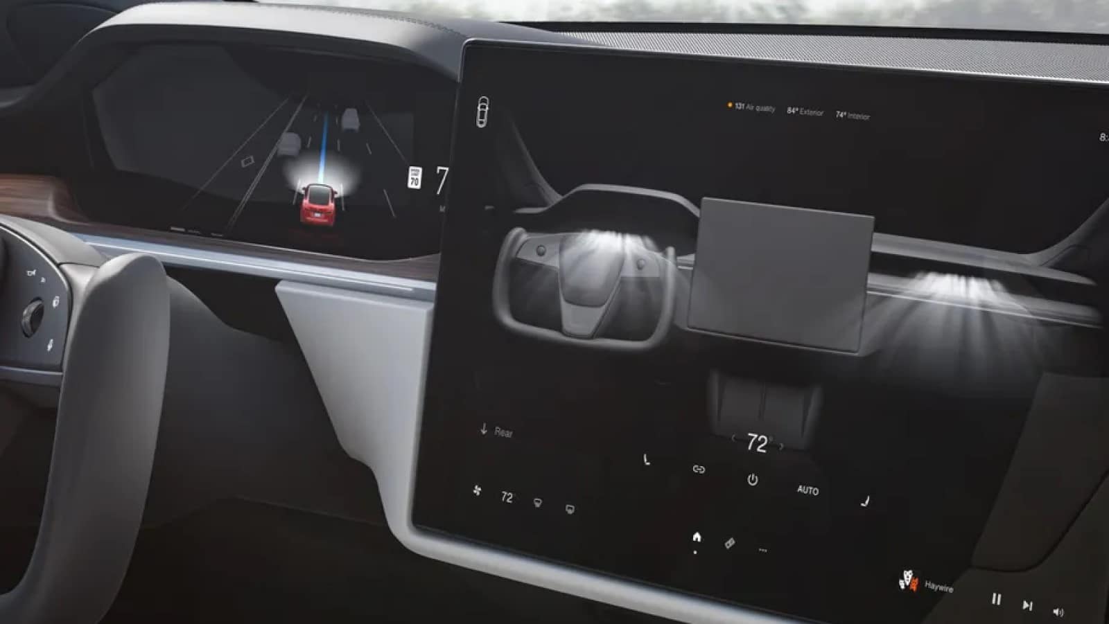 tesla interior showing car icon on touchscreen for gear selection