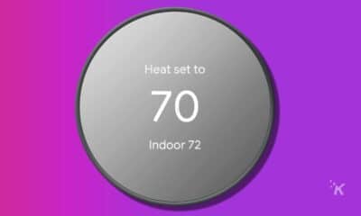 google nest thermostat on purple background