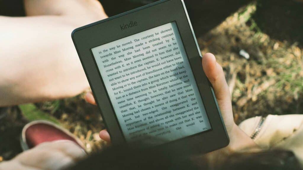 kindle tablet in hand