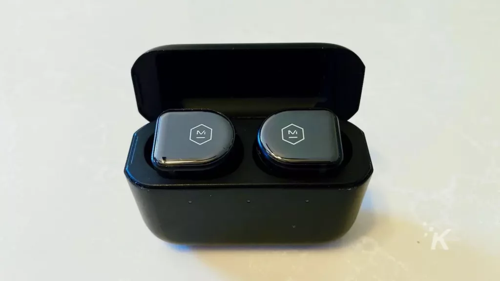 master dynamic mw08 earbuds on kitchen desktop