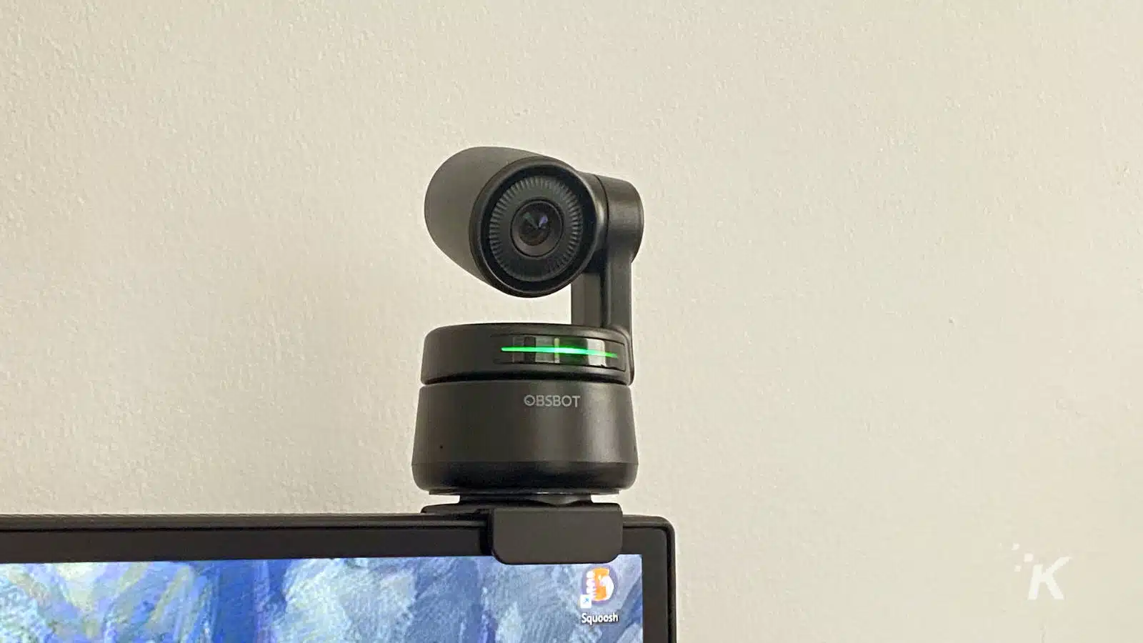 obsbot tiny ptz webcam mounted over a computer monitor