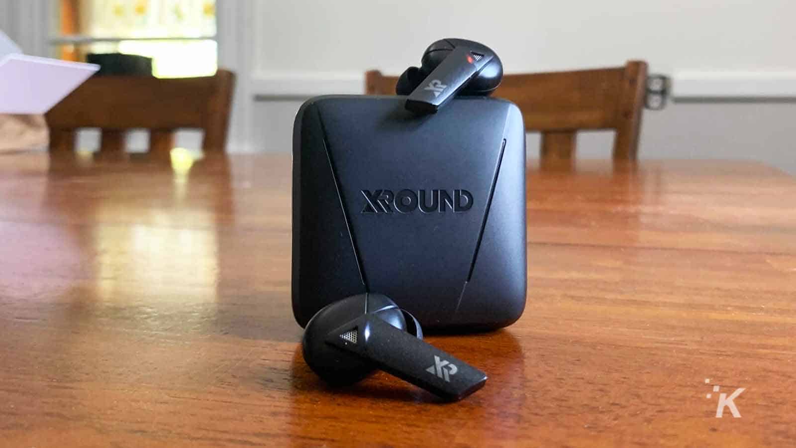 xround aero earbuds on table