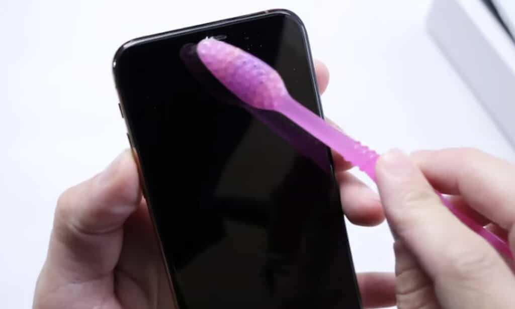 Clean your iphone speakers using a soft-bristled brush