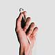 wired earbuds in-hand