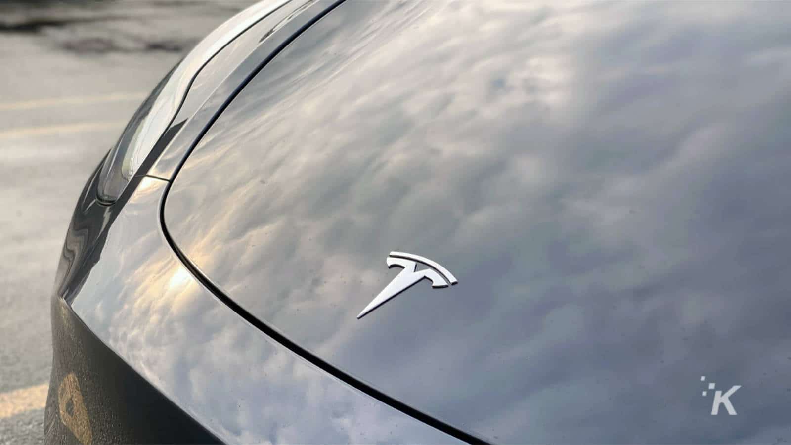 tesla badge on model 3 with full self-driving