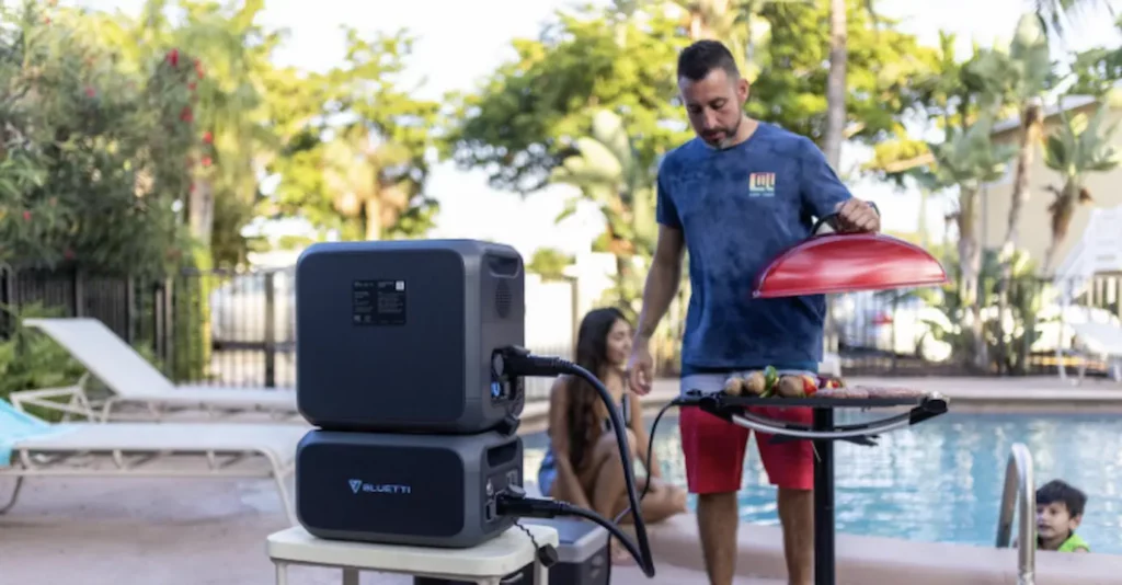 guy grilling using a bluetti ac200max power portable station