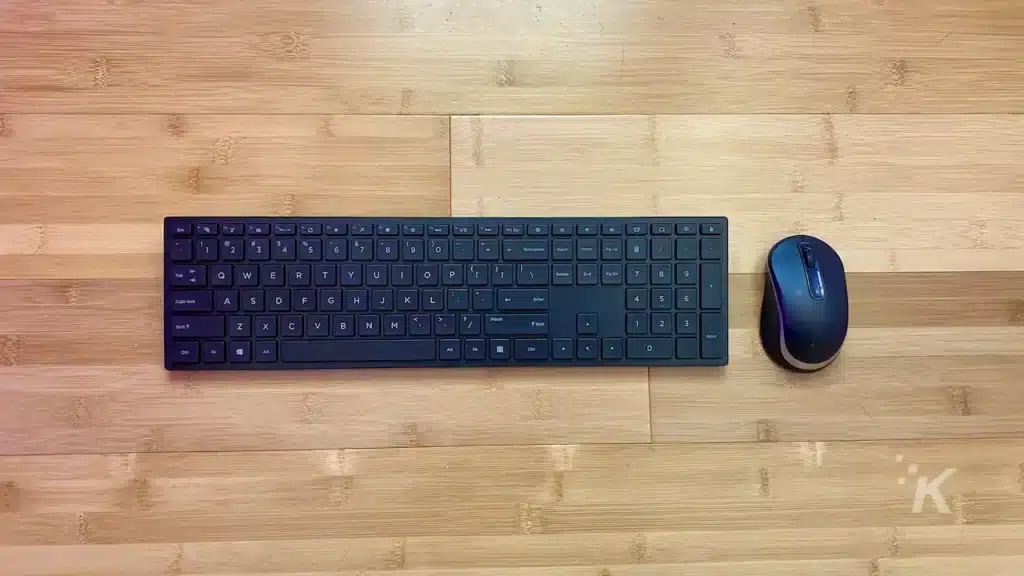 mouse and keyboard laying on hardwood floor