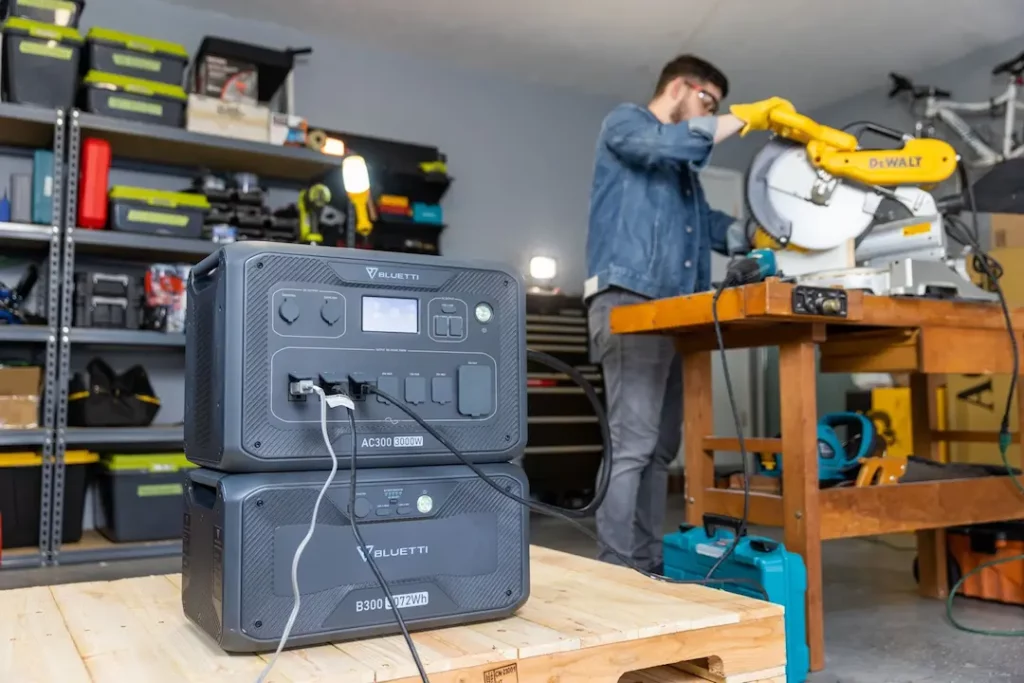 bluetti solar generator in a workshop next to man using powertools