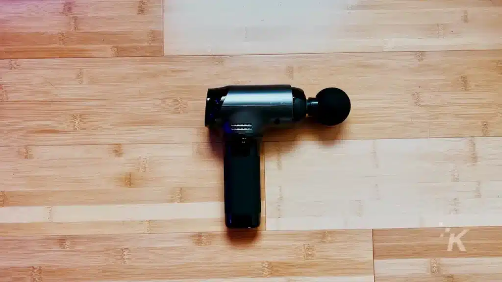 bob and brad massage gun on hardwood floor