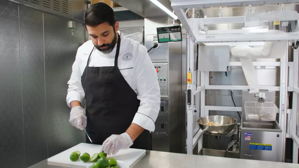 chipotle worker with chippy robot