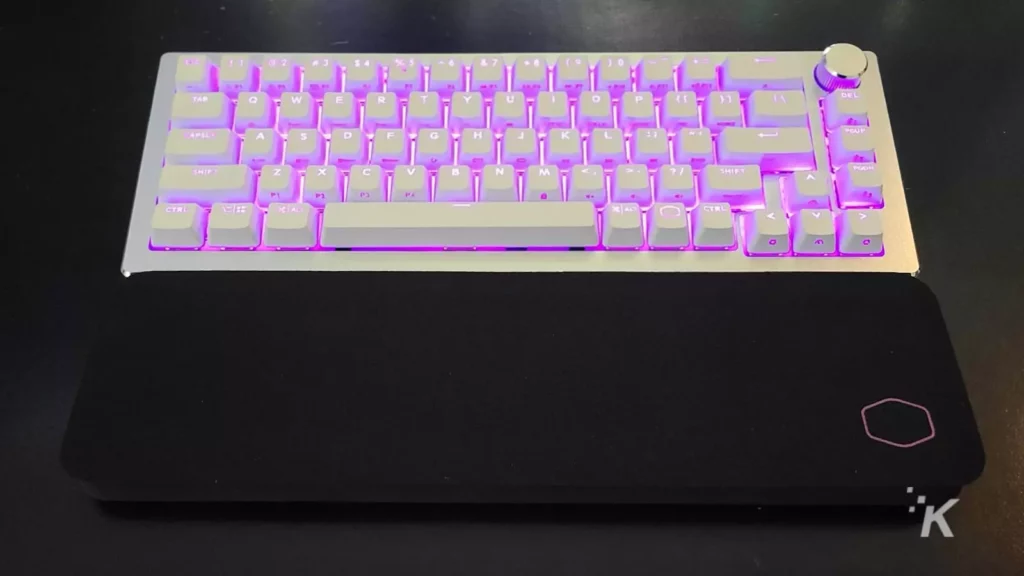 white gaming keyboard with purple rgb lighting