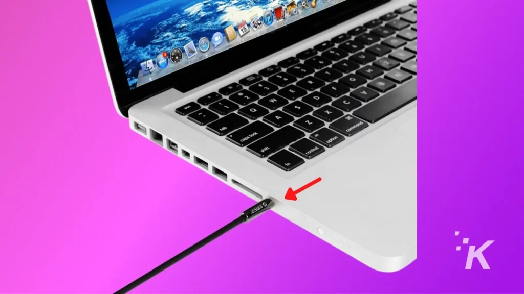 macbook showing an aux cable being plugged in