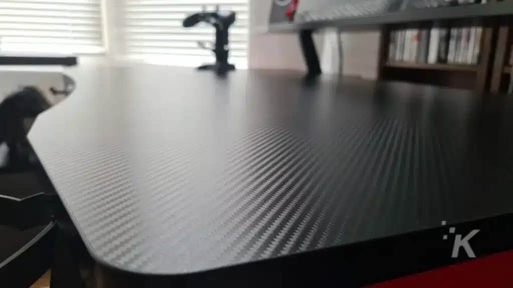 image showing carbon fiber on flexispot standing desk. 