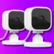 image of two blink mini security cameras on a purple background