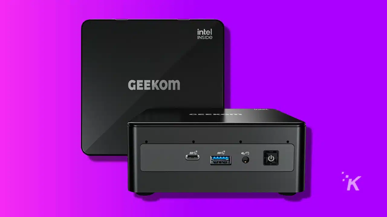 image of a geekom mini pc on a purple background