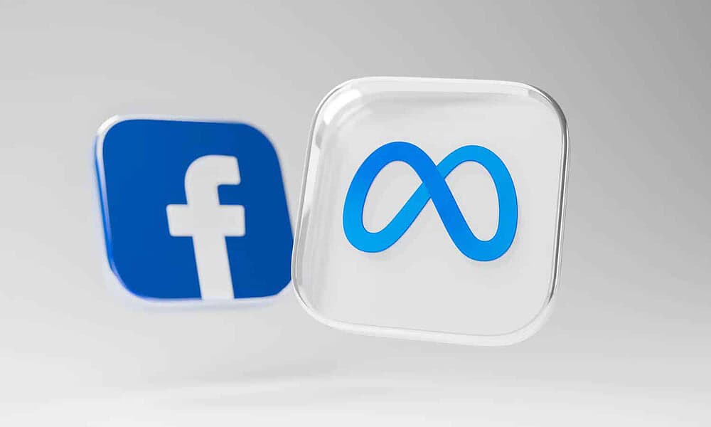 meta and facebook logo on grey background